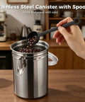 Heavy Duty Stainless Steel Canisters With Airtight Lock Buckles No Sweat Food Storage Jars Game Changing Pick For Coffee Beans, filled with coffee beans and a scoop.