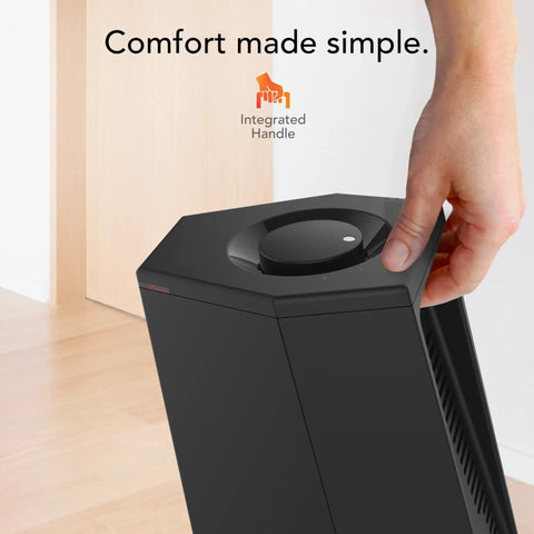 Person using manual dial control on Compact Desktop Personal Tower Heater With Two Heat Settings, 12 Inch Tall Black Design