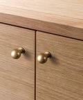 Six Pack Zinc Alloy Drawer Knobs 0.94 Inch Diameter Champagne Bronze Cabinet Knobs installed on wooden cabinets