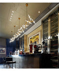 Modern Iron Pendant Light With Herringbone Pattern Dimmable LED Hanging Lamp in a stylish bar setting with spirits.