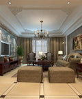 Elegant living room interior with chandelier, modern sofa, decorative vases, and recessed lighting in a luxurious setting