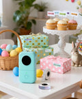 Portable Bluetooth Label Maker D30 With Three Tapes White Gold Clear, Handy Thermal Printer For Home Use on a table with Easter decor