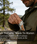 Man holding an Engraved Custom Pocket Knife For Men, Personalized Name And Message, Unique Gift For Husband Father Boyfriend Dad, Premium Steel.