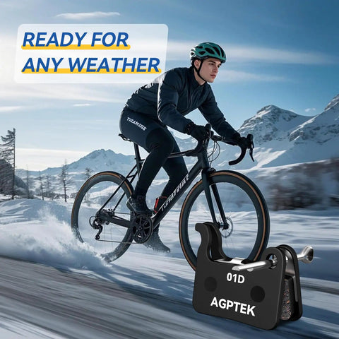 Cyclist on mountain bike in snow, showcasing Four Pairs Semi Metallic Mountain Bike Disc Brake Pads For Shimano Deore XT SLX.