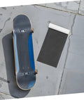 Rolled Premium Grip Tape Sheets For Skateboards And Electric Scooters Waterproof Non Slip Deck Cover next to skateboard on pavement