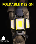 Person holding Rechargeable 30W LED Work Light with foldable design and magnetic base in a workshop setting.