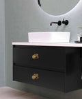 Top Shelf Antique Brass Cabinet Knobs With Quatrefoil Backplate on modern black bathroom vanity with white countertop.