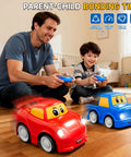 Father and son playing with Twin Remote Control Cars For Toddlers 2 Pack Blue Truck And Red Race Car 2.4 GHz indoors