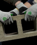 D Roc ANSI A4 Reinforced Thumb NitriX Palm Work Gloves 12 Pairs Size 9 Large lifting a concrete block