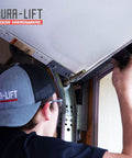 DURA-LIFT double-T rubber weather seal for 8' wide garage doors, being installed.