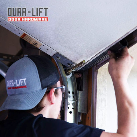 DURA-LIFT double-T rubber weather seal for 8' wide garage doors, being installed.
