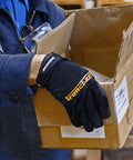 Box Handling Work Gloves With Extreme Grip And Performance Fit in use, holding a box in a warehouse, small size visible.