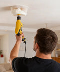 Workhorse Six And Four Inch Hole Saw Kit With Reusable Silicone Dust Bowl For Smooth Zero Mess Cuts On Recessed Lighting Ceiling Vents in use.