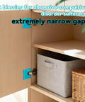 Cabinet with precise door hinge alignment shown, highlighting extremely narrow gaps and neat storage baskets inside.