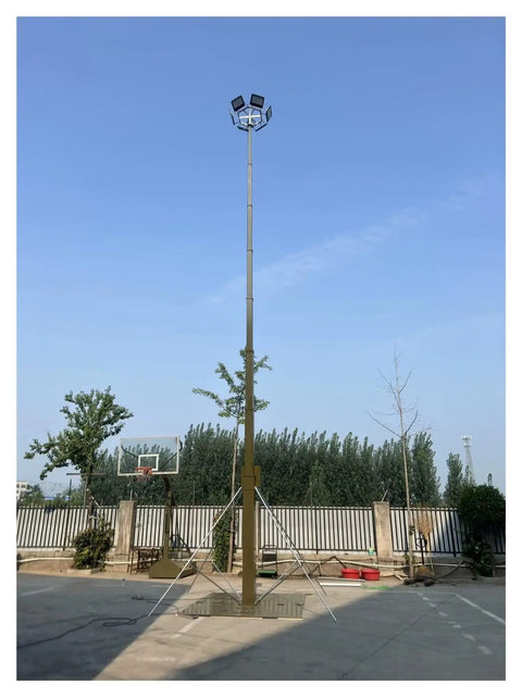 Pro Grade Manual Telescopic Aluminum Mast Expands From Two Point Five Meters To Ten Meters Portable Camera Pole set up with flood lights outdoors.