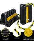 Heavy Duty Rubber Wheel Chocks With Rope For RVs Campers Travel Trailers Cars And Trucks Easy To Use Wheel Immobilizers Grippy No Slip Tire Chocks For Parking Durable 4 Pack Two Pairs shown with yellow reflective stripe and rope on black surface.