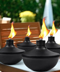 Six Pack Upgraded Tabletop Citronella Torches With 24 Oz Fuel Capacity Refillable Outdoor Torch Lights in garden setting