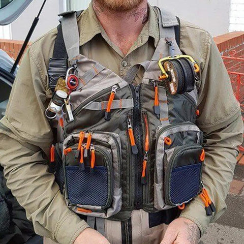 Man wearing lightweight mesh fishing vest for men and women with 17 pockets, breathable back panel, army green, fly fishing gear visible