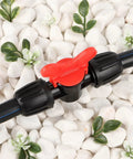 Half Inch All In One Pro Grade Irrigation Fittings Kit For 16mm Drip Tubing With Barbed Connectors shows a red valve on black hose