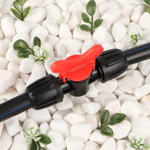 Half Inch All In One Pro Grade Irrigation Fittings Kit For 16mm Drip Tubing With Barbed Connectors shows a red valve on black hose