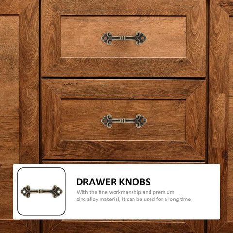 Drawer featuring a handle from the 20-Piece Mini Antique Bronze Cabinet Pulls Set For Jewelry Boxes And Small Drawers, Rustic Metal Hardware.
