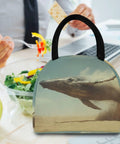 Whale Desert Jump Insulated Lunch Bag For Women Men with whale print, durable handle, and food-grade liner on office desk.