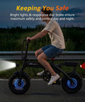 Rider on Powerful 1200W Peak Motor Foldable Ebike For Adults With 25 MPH Top Speed 45 Mile PAS Range in evening commute