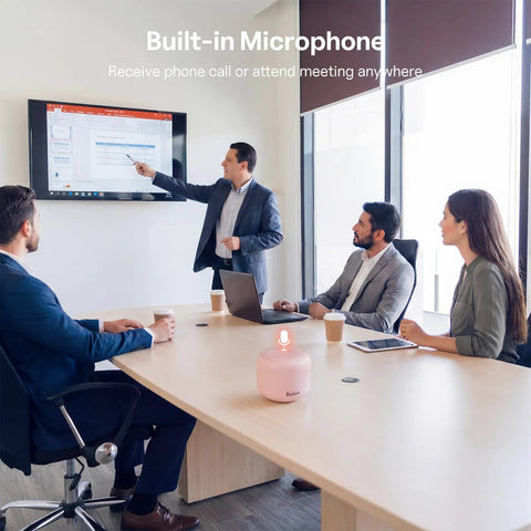 Office meeting with Ultra Portable Bluetooth Speaker With Strap For On The Go IPX5 Waterproof Mini Speaker Pink on table
