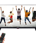 27 Inch CCTV Monitor For Surveillance With Full HD 1920x1080 Display showing people jumping by the sea with remote control in hand