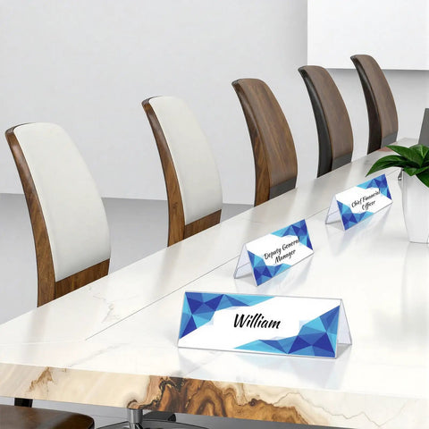 12 Pack Clear Acrylic Desk Name Plates Three By Eight Point Five Inches Thick Two Point One Millimeters Lightweight 110g Each Reusable Name Tent Holders For Office Meetings Conferences And Business Events on a marble table with chairs