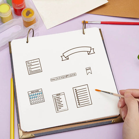 Super Slick Reusable Calendar Clear Stamps That Hit Different For Your Daily Journaling Setup on a journal page with outlines and checklist.