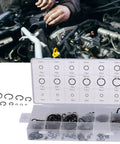 Auto Repair Snap Ring Kit For Home Garage, 300 pcs of internal and external retaining rings in open box with engine work in background