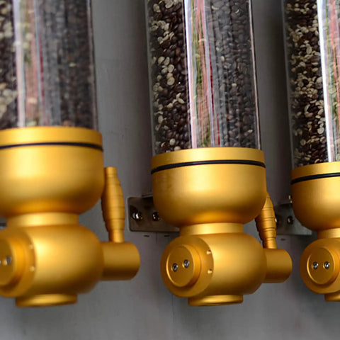 Killer Wall Mounted Coffee Bean Dispenser With Durable Aluminum And Clear Acrylic Canister Totally Airtight 5KG Storage Jar For Home Baristas Or Cafe Stash In Glossy Gold Two Pack showcasing gold dispensers with various coffee beans.