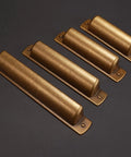 Four 2.5 inch antique brass cabinet handles with a bronze finish, side view. 10 Pack 2.5 Inch Antique Brass Cabinet Handles And Cup Pulls Set