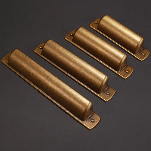 Four 2.5 inch antique brass cabinet handles with a bronze finish, side view. 10 Pack 2.5 Inch Antique Brass Cabinet Handles And Cup Pulls Set