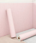 Peel And Stick Thermal Wall Covering For Sound Dampening in light pink, showcasing textured finish and unrolled section.