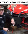 Man showing heavy duty winch cover on ATV, demonstrating the Heavy Duty Winch Cover With Drawstring And UV Resistant Waterproof Shield.