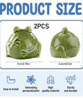 Dang Cute Frog Themed Ceramic Toilet Bowl Bolt Covers Two Piece Kit Rust Resistant with two green frog figures, size 7cm and 6.6cm.