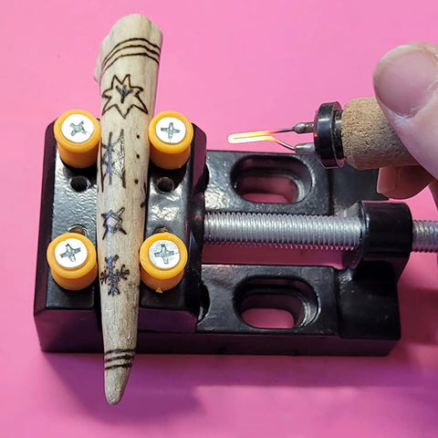 Universal Mini Drill Press Vise Clamp Set For Jewelry Making Watch Repair And DIY Craft Carving, holding a small wood piece.