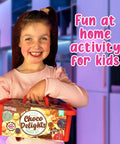 Child holding Totally Fun Chocolate Making Kit For Kids With Candy Bar Molds Lolly Sticks And Wrappers A Fun Creative Activity