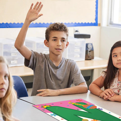 Student in classroom with 'N' from Bienvenidos Welcome Poster Set For Spanish Classrooms 11 Learning Posters 12 By 18 Inches