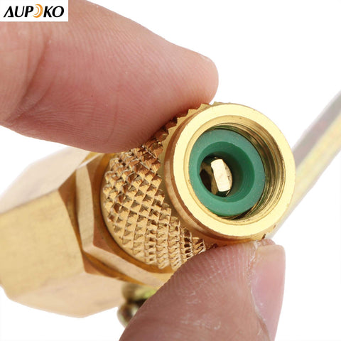 Close-up of Air Conditioning Ball Valve One Quarter Inch SAE Adapter showing brass texture and threading detail