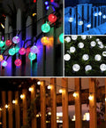 Solar Powered String Lights With 200 LEDs, 72 ft Long, 8 Modes, Waterproof Crystal Globe Balls illuminating a fence