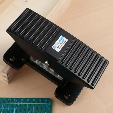 Five Way Three Position Center Closed Pneumatic Foot Pedal Valve With Leak Proof Zinc Alloy Body on wooden surface