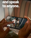 Ring Spotlight Cam Plus Battery, white security camera; smartphone displays live HD video of two people at a doorway.