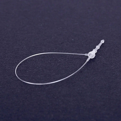 Heavy Duty 5000 Piece White Plastic Hang Tag Snap Locks, 5in long, clear plastic, used for securing price tags on merchandise.