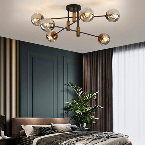 6 Light Glass Globe Sputnik Chandelier With Dope Matte Black And Gold Finish Modern Ceiling Fixture in bedroom setting.
