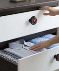 4 Pack Acrylic Round Cabinet Knobs With DJ Monkey Design on dresser drawers in modern home decor setting