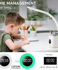 Child using Upgraded 10W USB Desk Lamp With Clock Pen Holder Timer And Ambient Color Night Light on study desk