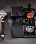 53mm Espresso Tamper Station With Spring Loaded Tamper And WDT Tool For Flawless Pulls displayed with portafilter, tamping tools, and brush.